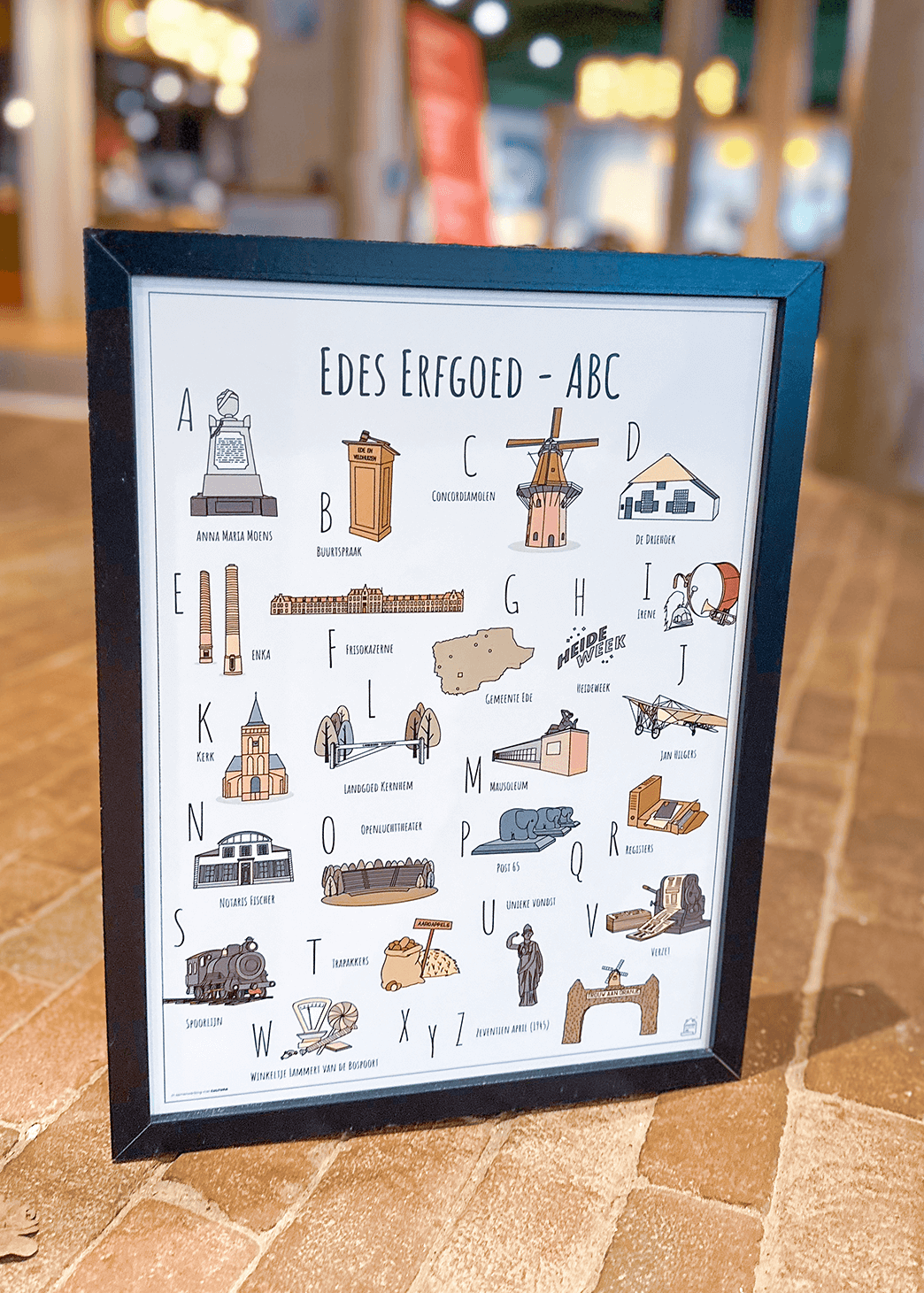 Erfgoed ABC poster Ede bij Cultura - Een unieke poster met herkenbare en handgetekende illustraties van Edes Erfgoed product afbeelding